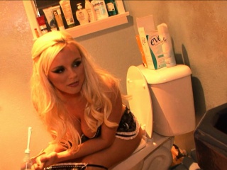 Bree poses for some sexy pictures and takes a pee when she's done